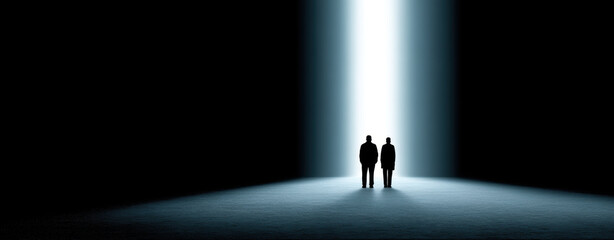 powerful image depicting two figures standing dark space illuminated by bright beam of light. This scene evokes feelings of hope and guidance