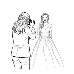 Fototapeta premium Photographer directing happy bride during wedding photoshoot 