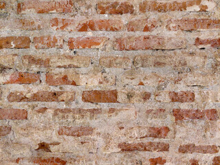 Red orange brickwall texture on an exposed wall with cement and natural contour.