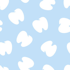 Simple seamless pattern with teeth on blue background. Pattern for uniforms, clothing, textiles, covers, wallpapers, wrapping paper, backgrounds, surfaces. Simple teeth isolated on the background.
