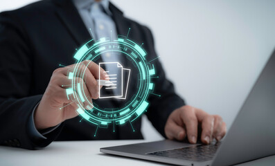 Businessman accessing futuristic digital document interface with data icons and virtual file transfer in an online paperless workflow system