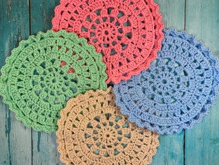 Crocheted mandala doily on wooden background handmade decor art craft photo	
