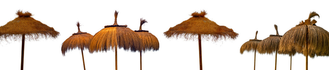 straw beach umbrellas isolated on white background, tropical thatched beach umbrellas