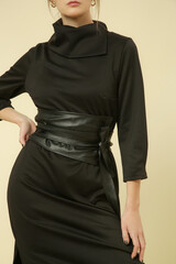 Serie of studio photos of female model in black midi dress, autumn winter fashion collection.	
