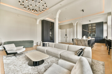 A beautifully designed modern living room featuring elegant furniture, stylish decor, and ample natural light, creating a warm and inviting atmosphere.