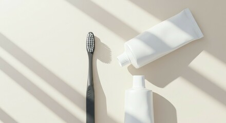 Toothbrush and Tubes of Paste on Beige Background with Shadows