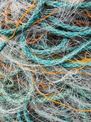 Full frame image of turquoise nautical nylon rope and fishing net