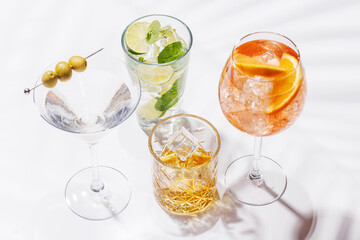 A vibrant display of cocktails, including Aperol Spritz, Mojito, and Martini