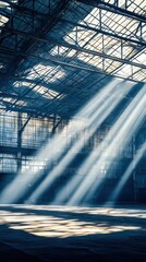 Light beams filtering through open steel roof abandoned warehouse high fidelity imagery industrial environment dramatic viewpoint ethereal concept