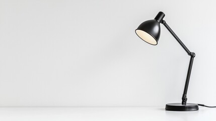 Desk lamp illuminating a clean, minimal workspace with a neutral background in a contemporary setting