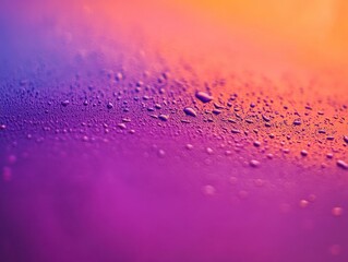 Water droplets abstract: An artistic, close-up perspective reveals a vibrant interplay of colors and textures, showcasing water droplets on a gradient surface.