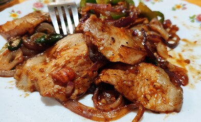 Fried pork dishes are found in numerous cuisines around the world. Known for its tenderness and versatility, pork is often prepared by frying for the resultant crispy and savory succulence.