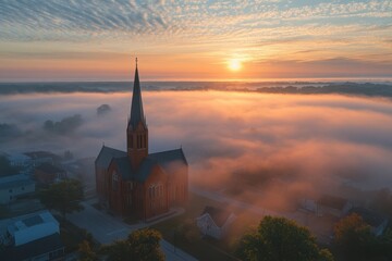 Fototapeta premium Celestial Sanctuary: A majestic church spire pierces through a sea of ethereal fog at sunrise, bathed in the warm, golden light of dawn. 