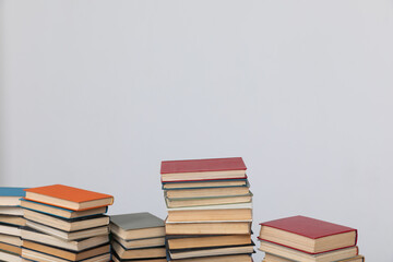 Stacks of educational books on a white background of the university library