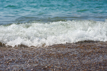 Soft wave of sea on sandy beach. Background.
