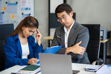 business people, teamwork, people and crisis concept - business team sitting sad and solving problems in the office..