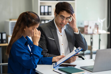 Fototapeta premium business people, teamwork, people and crisis concept - business team sitting sad and solving problems in the office..