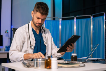 Medicine doctor hand working with modern digital tablet and laptop computer interface as medical network concept.