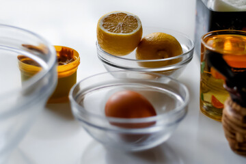 Fresh ingredients for homemade mayonnaise arranged on a clean kitchen surface. whole eggs, a bottle...