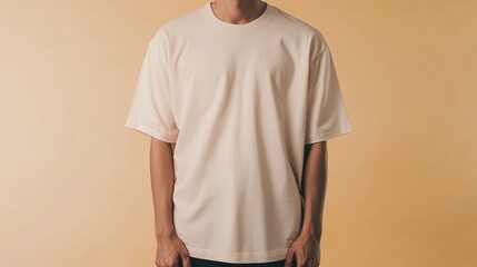 Cream-Colored Oversized T-Shirt on Male Model Against Warm Beige Background