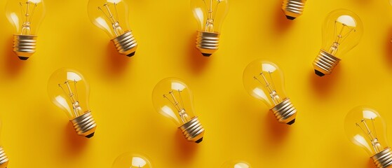 Colorful light bulbs on vibrant yellow background.