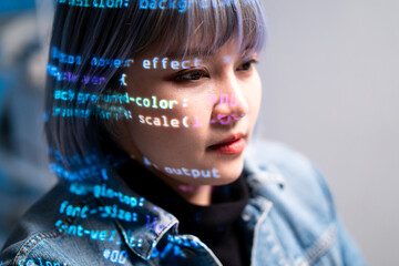 focused software engineer with projected coding lines her face, symbolizing innovation and...