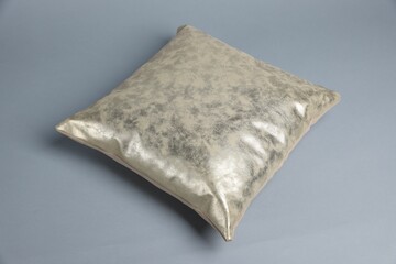 One soft decorative pillow on grey background