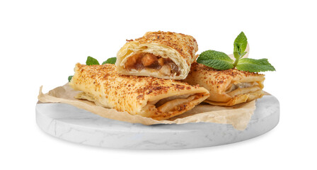 Tasty apple strudels and mint isolated on white