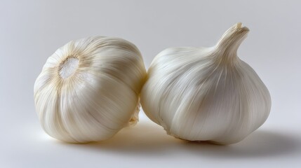 Obraz premium garlic cloves on a white background, minimalist style, simple composition