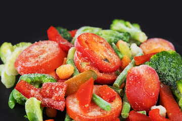 Frozen vegetable mix. Chopped mixture of carrots, corn, peas, legume, broccoli and pepper
