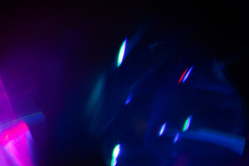 Blurred Light painting one exposure in camera. light glares with a spectral gradient on a dark background.