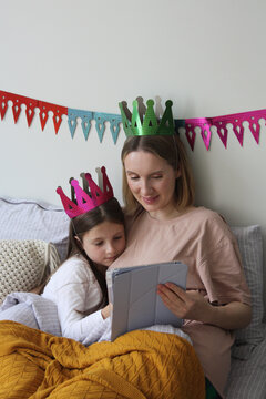 Mother and daughter enjoying a cozy reading time together