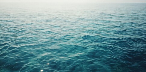 The Calm Ocean Surface Shimmers With Tranquility And Serene Beauty