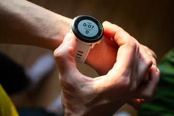 fit woman using a smartwatch for excercise