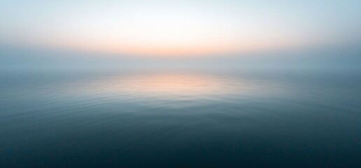 Misty ocean at sunset. Horizon in the background. Calming, peaceful