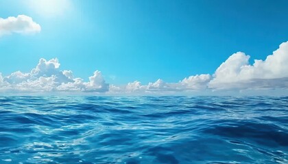 Fototapeta premium A serene view of the ocean under a bright blue sky filled with fluffy clouds.