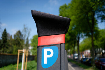 close-up of a modern parking meter in an urban outdoor setting in a residential  urban area with...