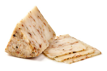 Seasoned cheese wedge with herbs and spices, isolated on white background.
