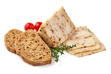 Seasoned cheese wedge with herbs and spices, isolated on white background.