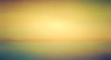 Abstract colorful background with rays of light evokes a beautiful sunset over the sea with orange and yellow hues reflecting on the water