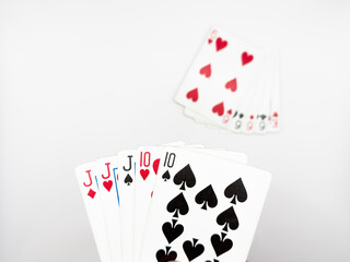 White plastic poker cards full house hit opponent in center on white background image