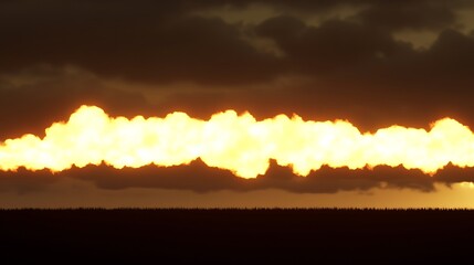 Golden light illuminates a low-lying cloud layer at sunset.