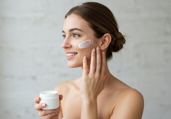 A side view of an anonymous smiling Caucasian female applying some body creme on her skin to stay smooth