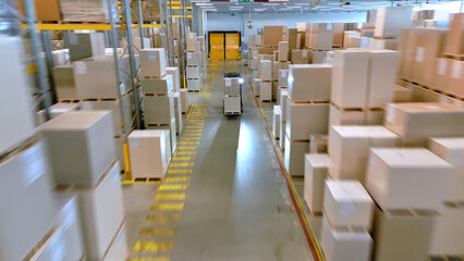 A fast-paced panorama of a bustling warehouse reveals a forklift navigating aisles filled with boxes, symbolizing global logistics and efficient supply chain management.