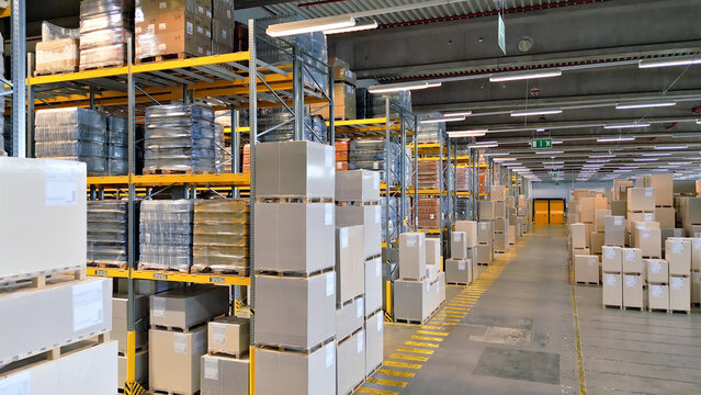 A panoramic warehouse shot reveals rows of packed shelves and pallets, symbolizing global supply chain efficiency and logistics organization.