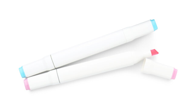 Double-sided marker pens on white background, top view
