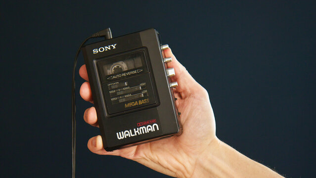 Berlin, Germany - April, 2025: Hand holding vintage Walkman. The Sony Walkman WM-B47 was a popular portable cassette player in the 80s and 90s.