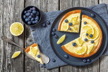 Cheesecake with blueberries sliced on a plate