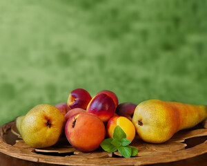 green juicy background.still life of fresh fruit on a carved wooden tray
