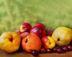 Beautiful summer background of ripe fruits and gooseberry berries close-up